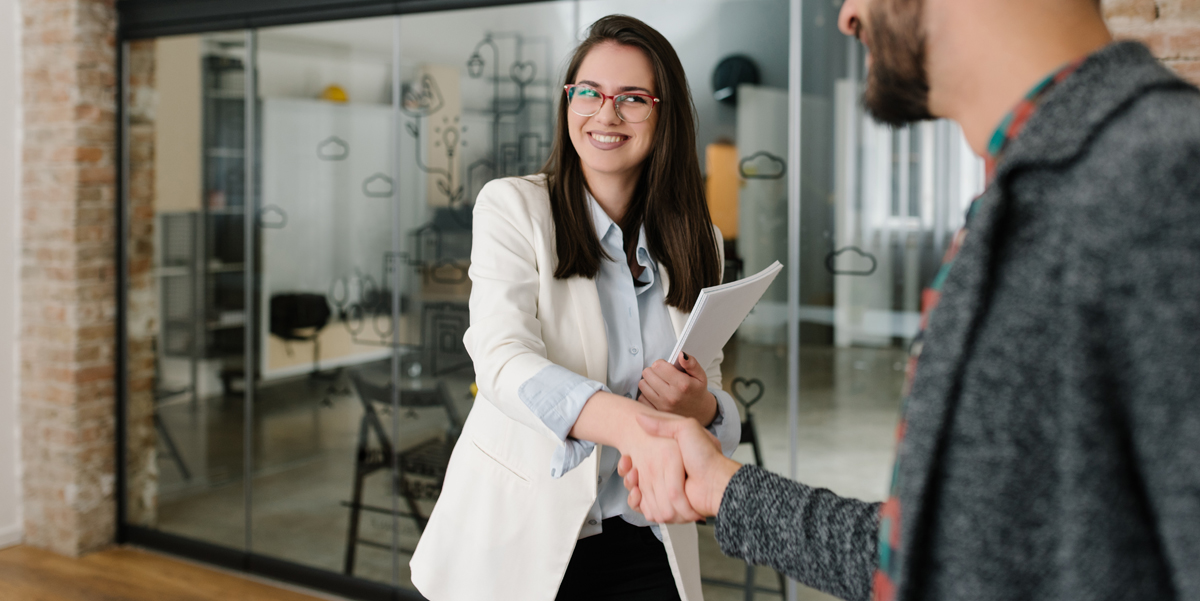 Russo CPA, Changing Jobs? Don't forget about Your 401(K). A woman shakes hands as she interviews for a job.