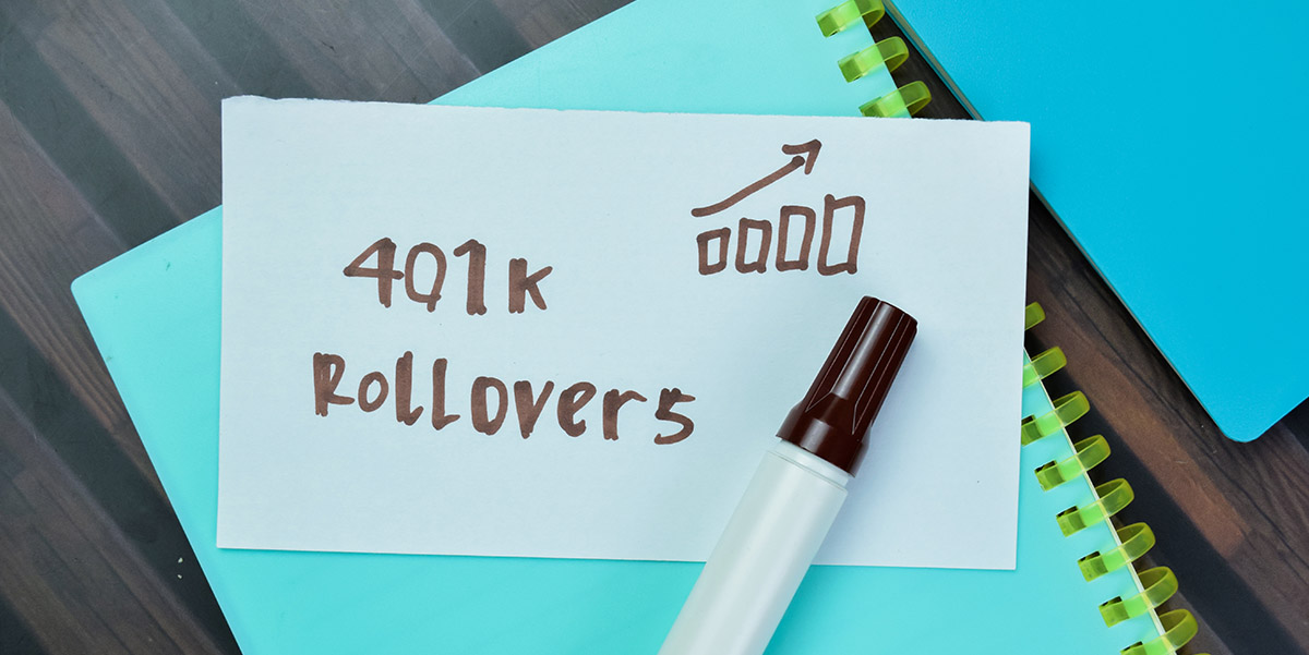 Paper and marker with 401K Rollover scribbled onto the paper.