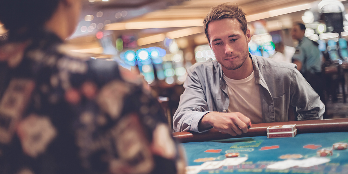 A man sitting at a gambling table.